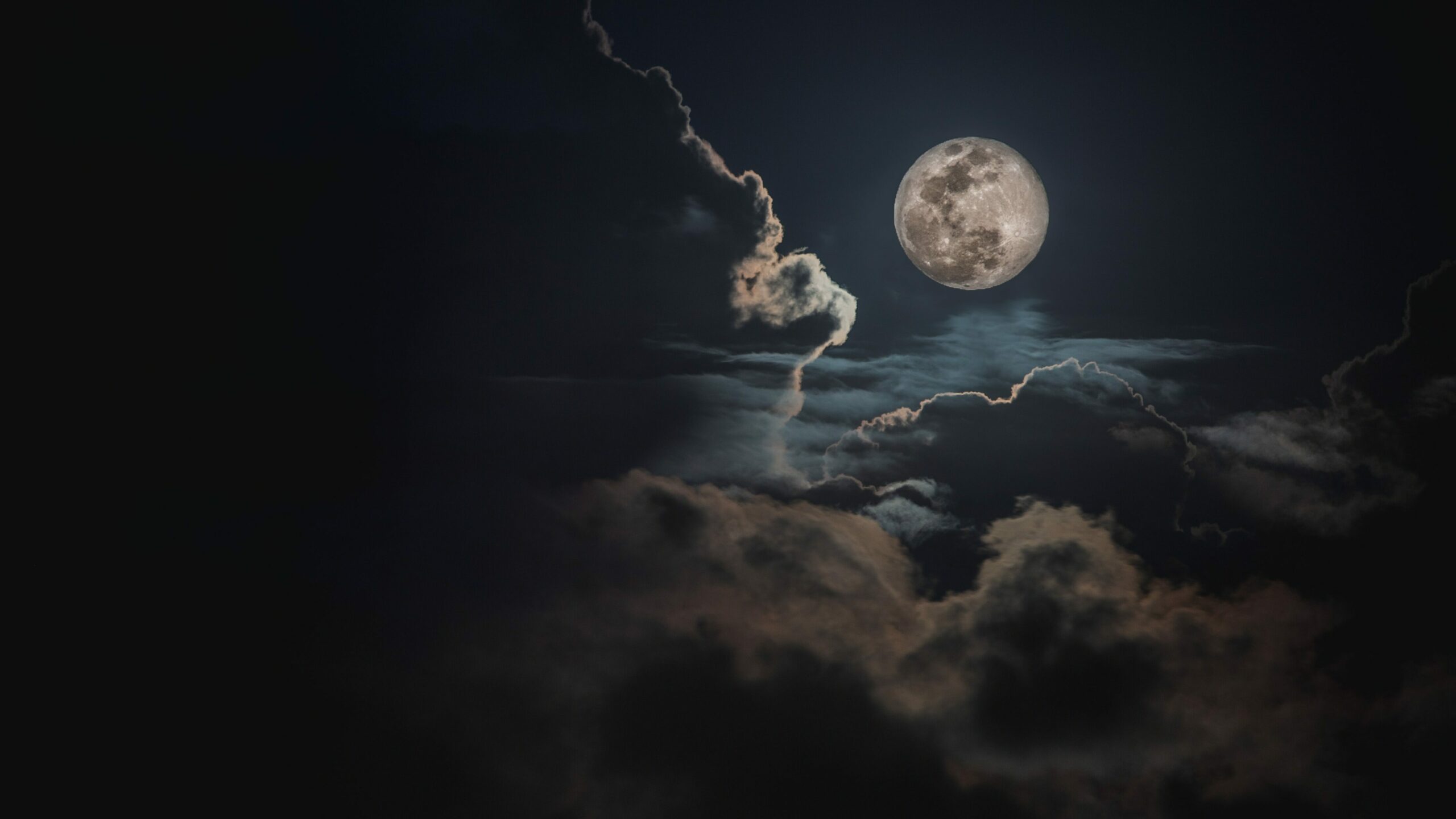 Image of a full moon and clouds.